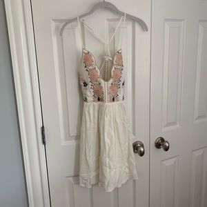 White sundress with floral detailing